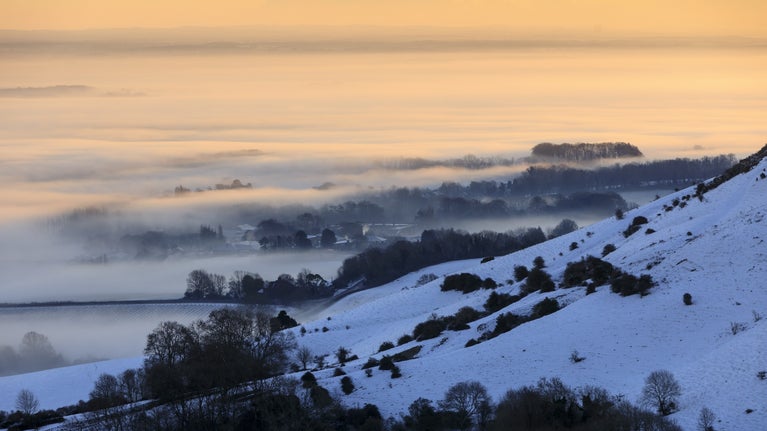Ditchling Beacon in the snow, with a sunset